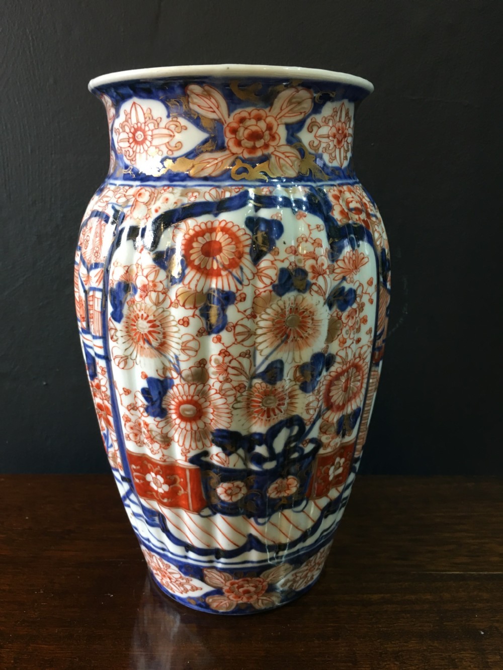 meiji period fluted vase chrysanthemum in main cartouchesfigures in boat cottage c19th