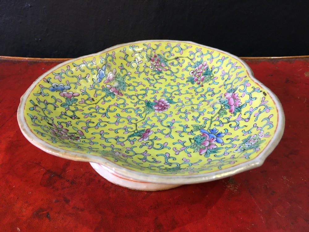 famille rose stem dish in the shape of ruyi head yellow ground with floral motif c19th