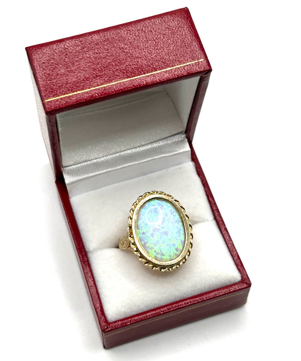 fine exceptional opal with flashes of green 9ct gold ring s