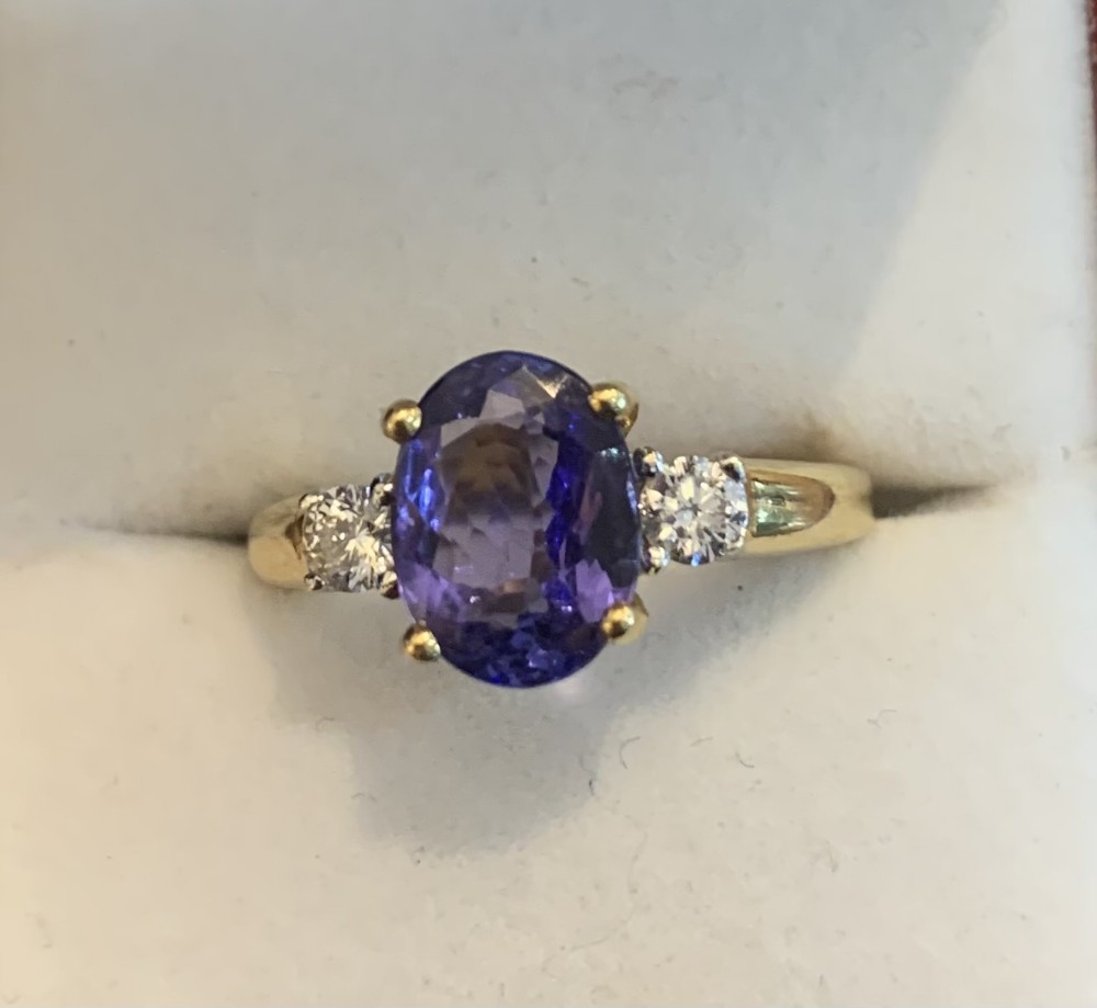 extremely fine 18ct gold diamond and tanzanite ring size o