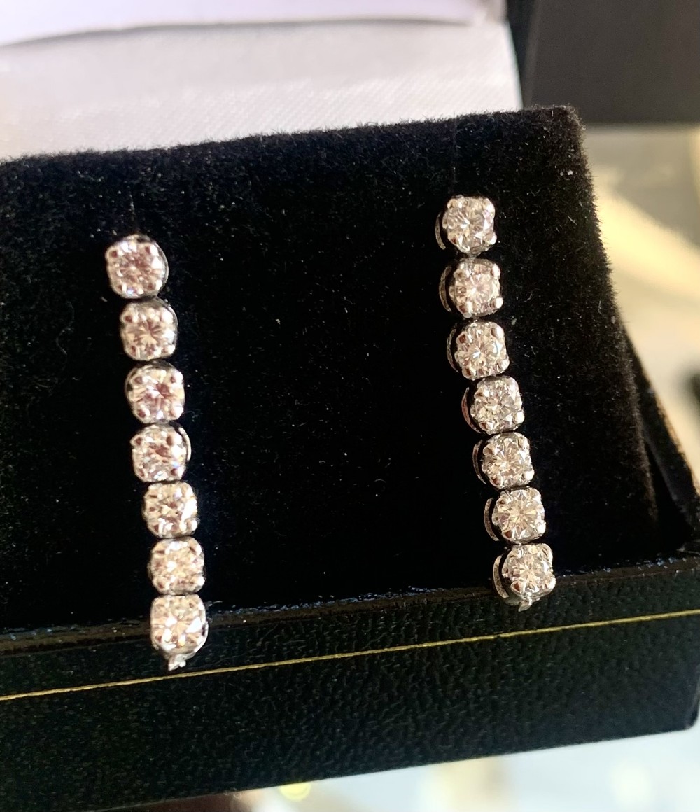 an exceptional pair of diamond drop earrings in 18ct white gold